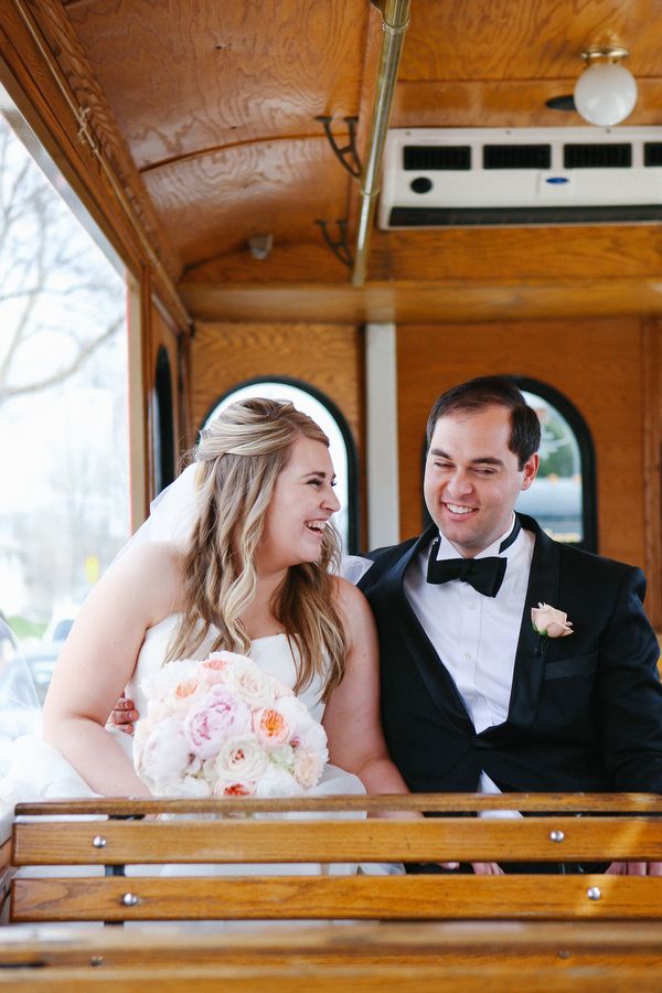 Bride and groom seated inside the trolley