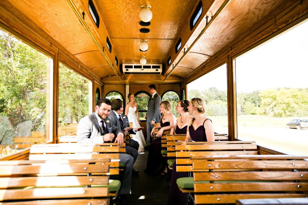 Wedding party riding inside the trolley